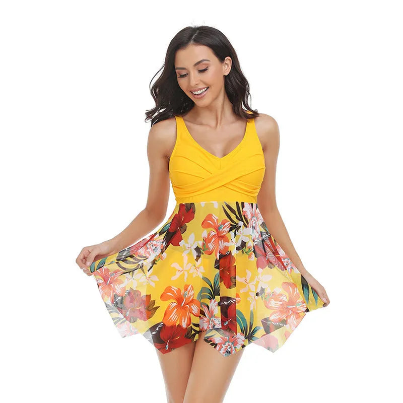 Women's one-piece swimsuit with a tulle skirt and split leg design in various colours.