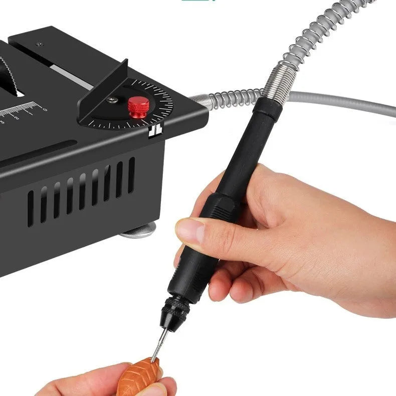 Compact metal cordless desktop saw with lithium battery on a workbench