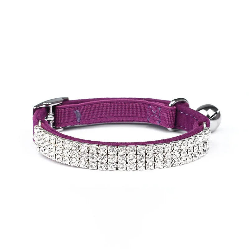 Red velvet cat collar with rhinestones, adjustable buckle, shown on a white background.