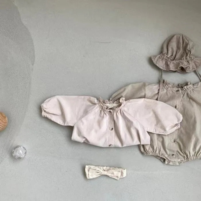 Baby cotton button jumpsuit romper in light lotus pink, long sleeves, wooden ear collar, suitable for 66-90cm height.