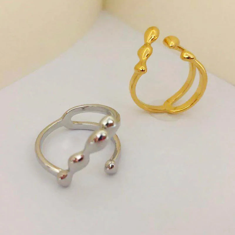 Brass spherical fashion ring in gold or silver colour for women
