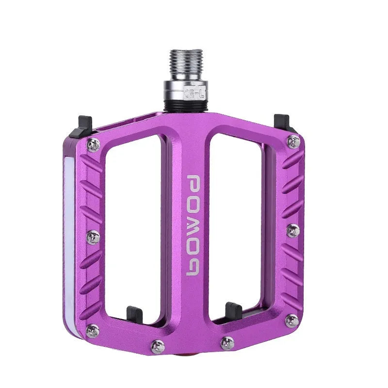 Aluminium alloy bicycle pedals with built-in 710LED lights in black, gold, purple, red, and titanium colour options.