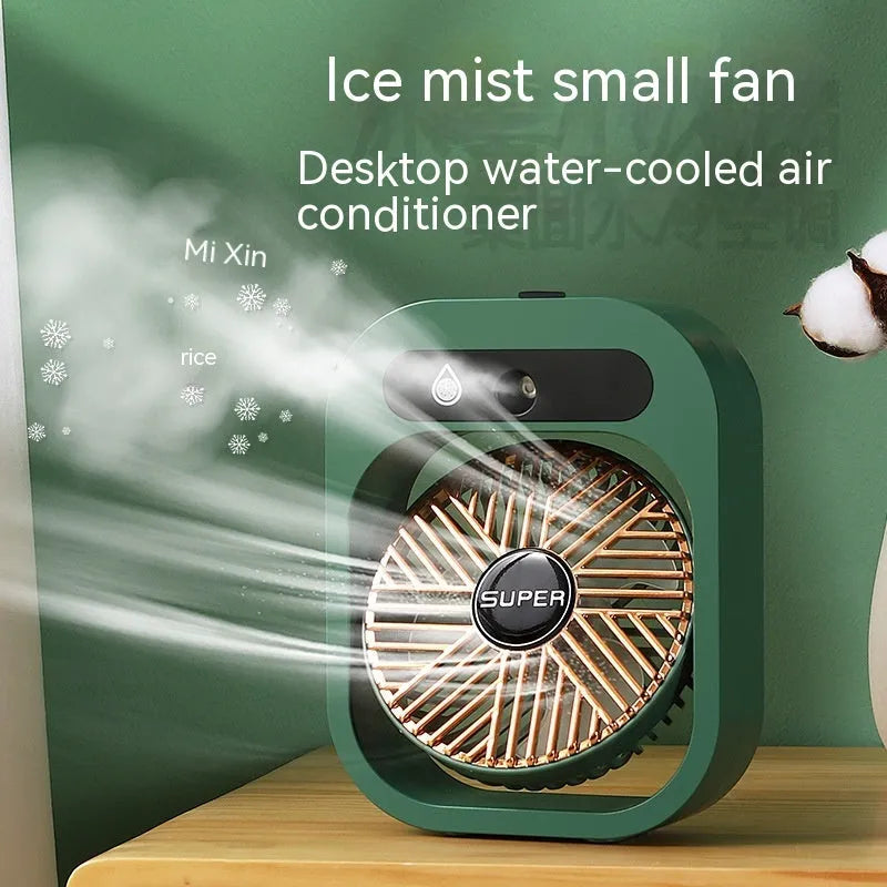 Green and white portable USB misting fan with water tank and adjustable air vent on a desk.