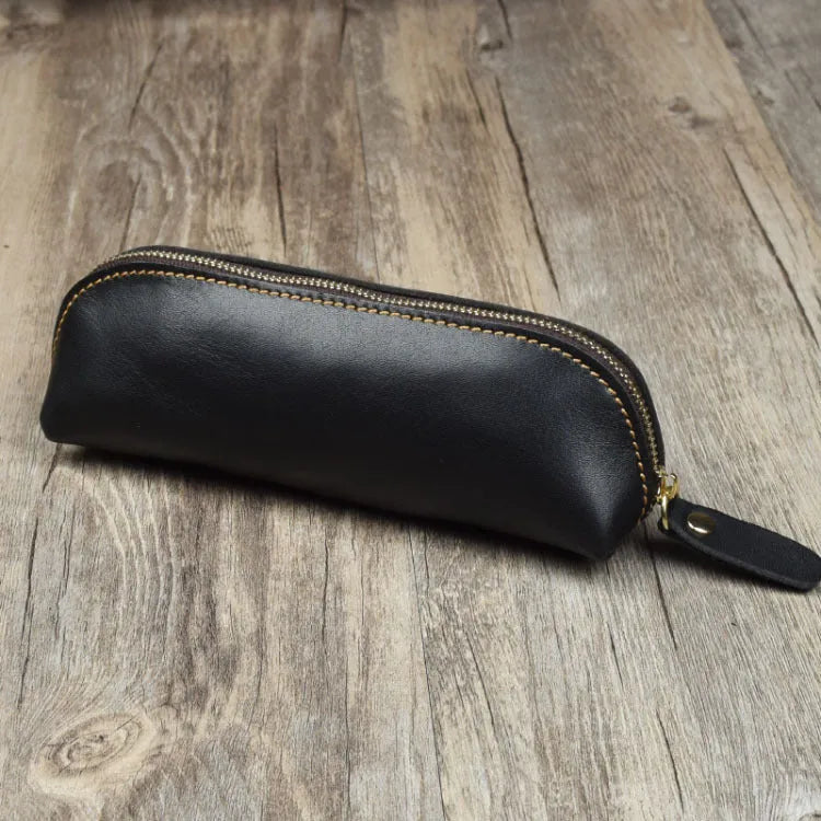 Black genuine leather pencil case with zipper closure measuring 18cm