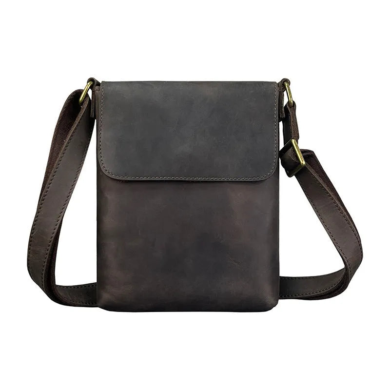Men's brown Crazy Horse leather crossbody backpack on a plain background, showing retro design and iPad pocket