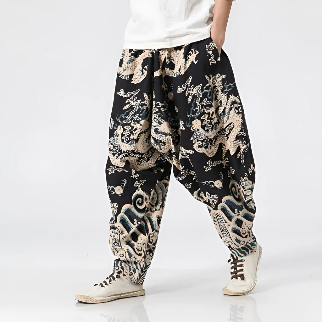 Men's hip hop cross pants with dragon print pattern and elastic waist in loose harem style.