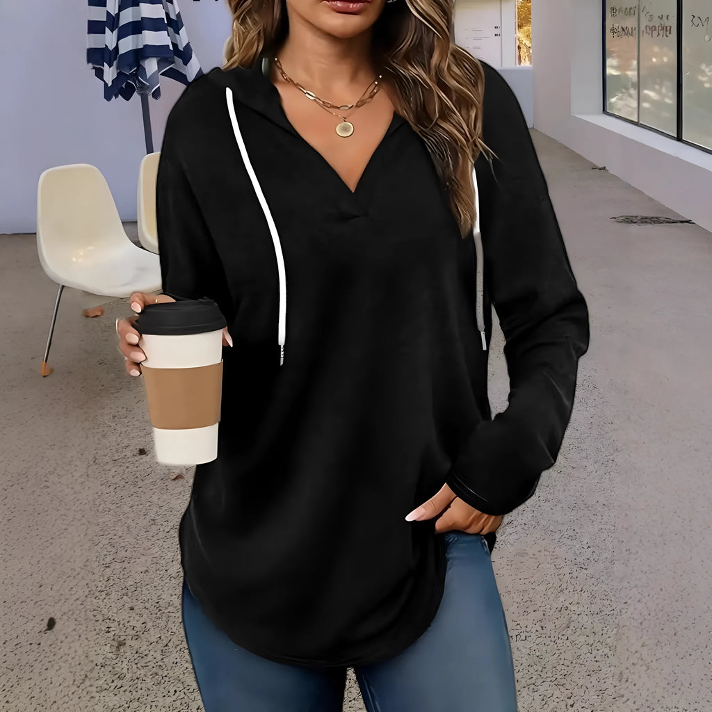 Red women's hooded V-neck sweatshirt with long sleeves on a hanger.