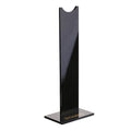 Pink and black detachable headphone stand for gaming headsets on a desk