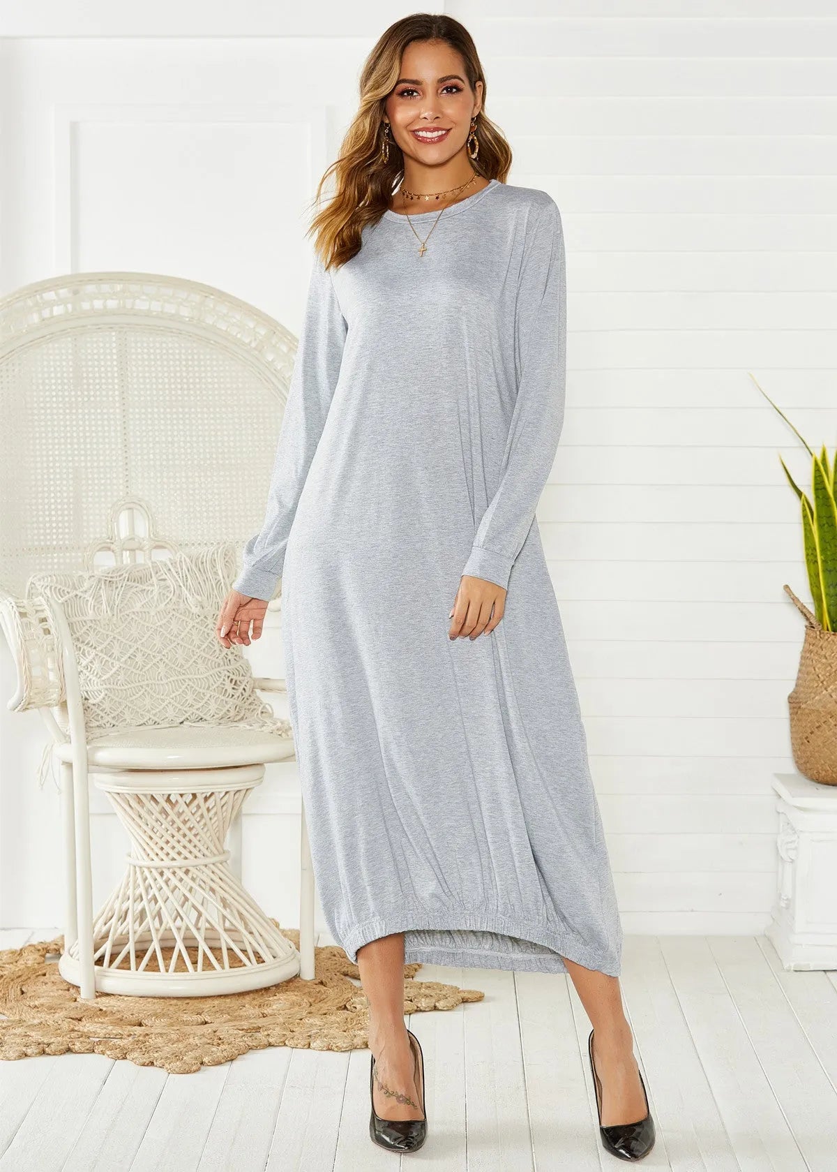 Black loose lace-up crew neck lantern dress on a hanger, casual polyester knit.