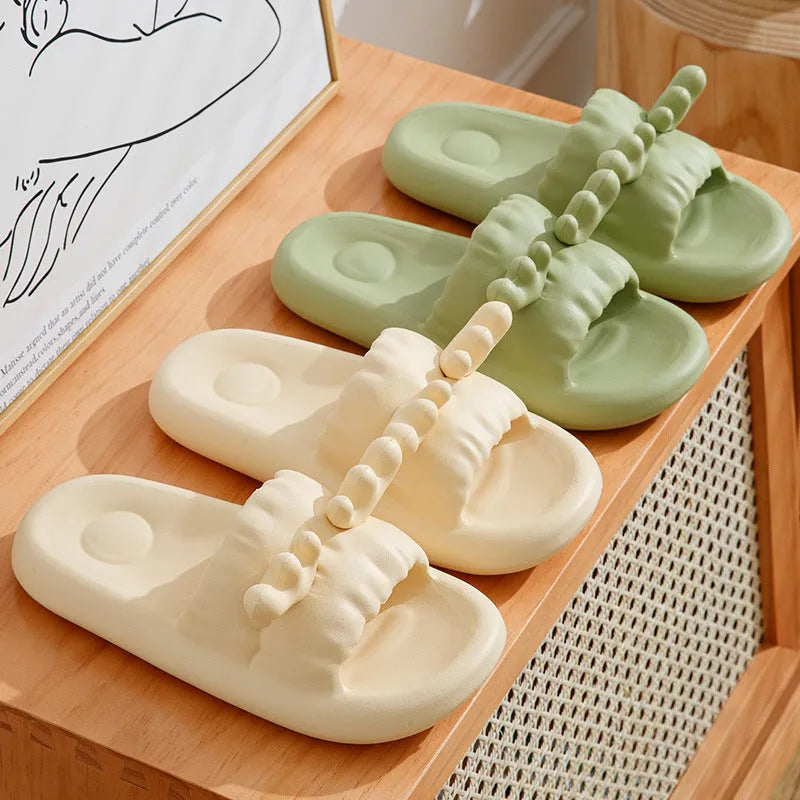Women's deer horn pattern EVA flip-flop slippers in light yellow, showing hollow-out design and textured sole.