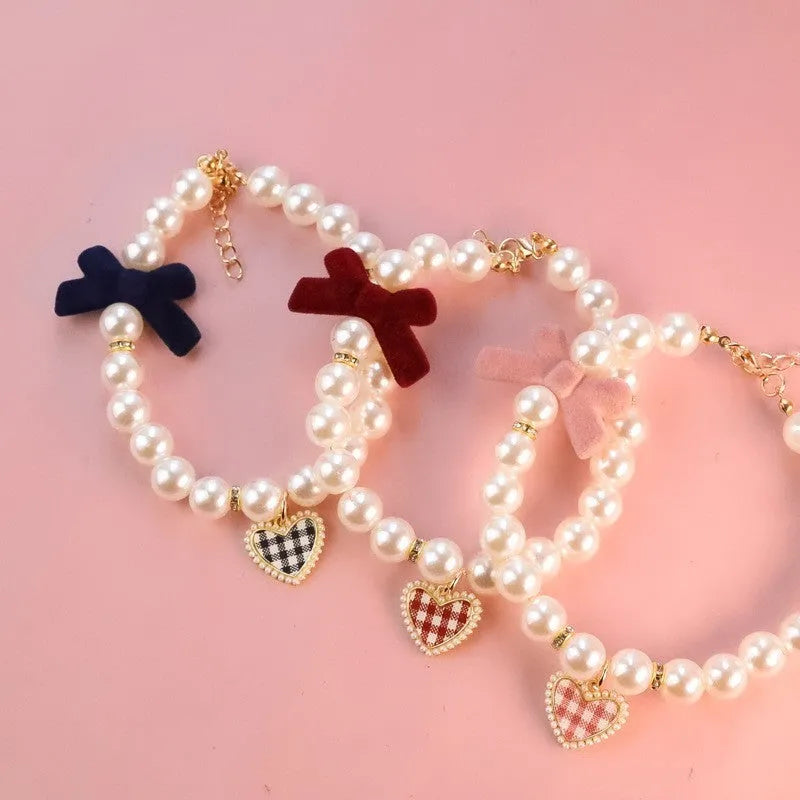 Retro plaid plastic bow necklace for cats and dogs, available in black, pink, and red sizes XS to L