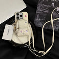 Crossbody wallet phone case for Apple iPhone with removable shoulder strap in antique white finish.