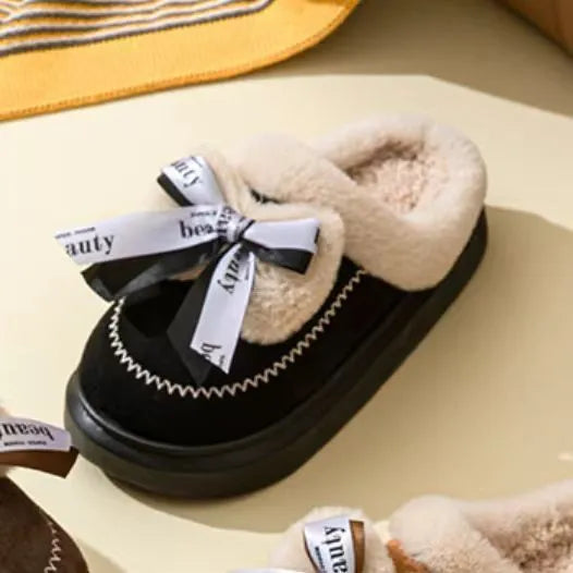 Women's beige suede half slippers with a ribbon bow and thick light-coloured sole