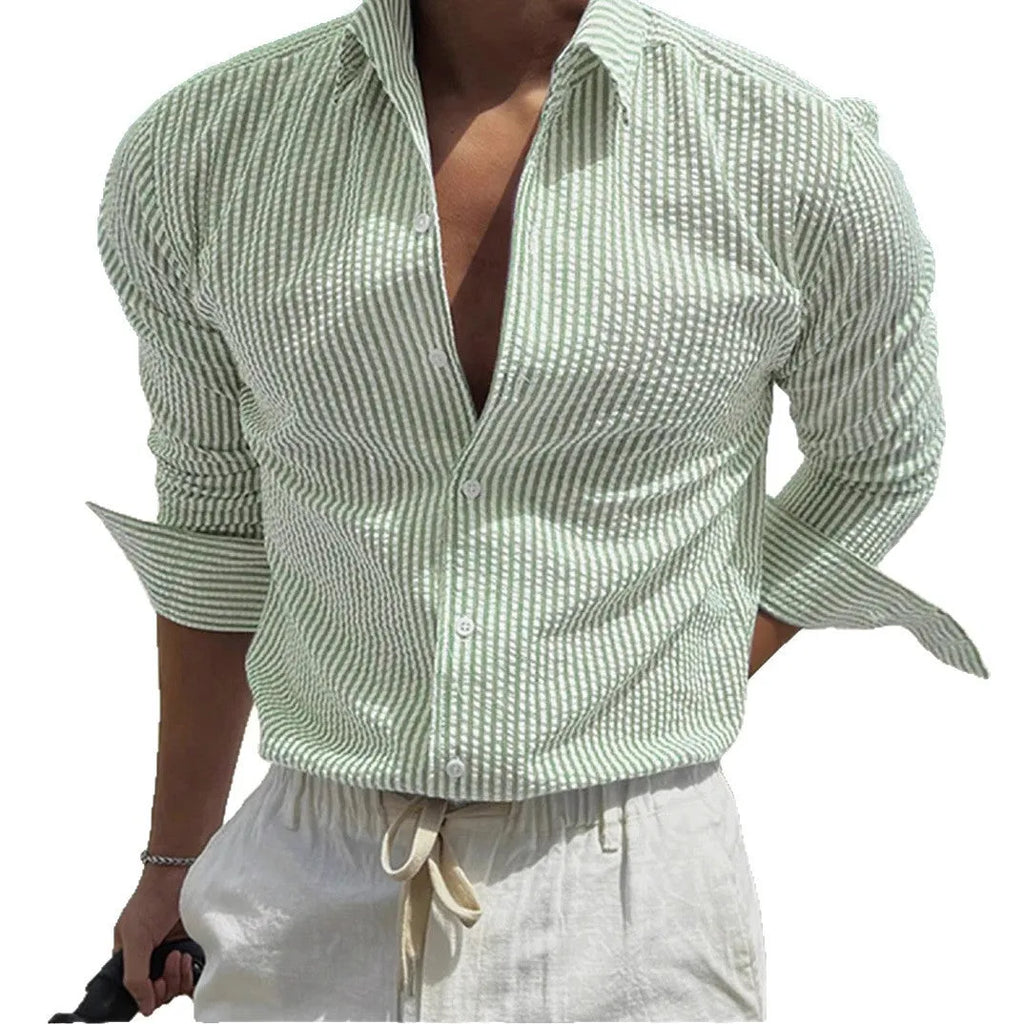Man's blue and white striped button-up shirt with a lapel collar and long sleeves.