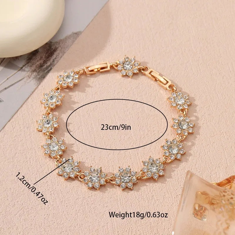 Electroplated zinc alloy floral bracelet showing colour variations including gold and silver tone options