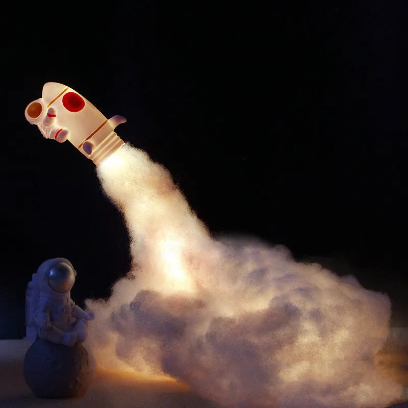 DIY LED Astronaut Rocket night light kit with string lights and assembly components on a desktop