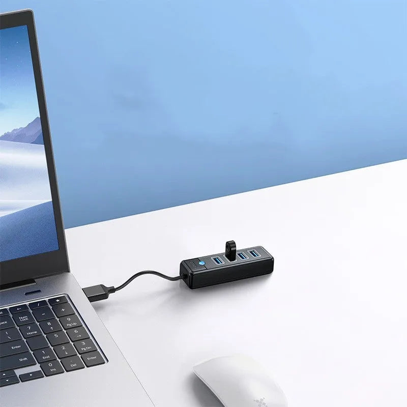 Black ABS 4-port USB 3.0 hub with USB-A input and multiple cable lengths for notebooks