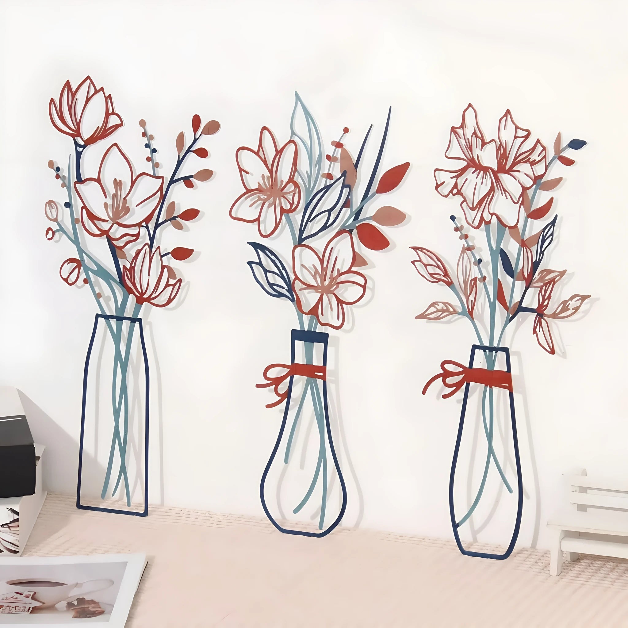 Three metal wall art pieces with flower designs and colourful vases in modern farmhouse style
