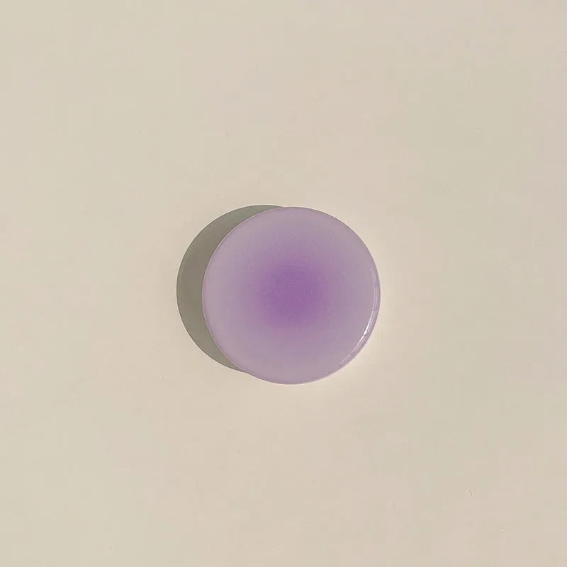 Yellow and purple gradient silicone iPhone case with a retractable X bracket extended.
