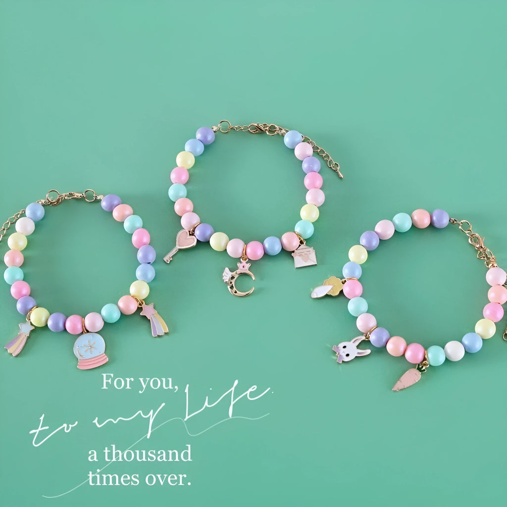Colourful resin necklace collar and bracelet set for a dog, showing macaron-themed rabbit and moon charms.