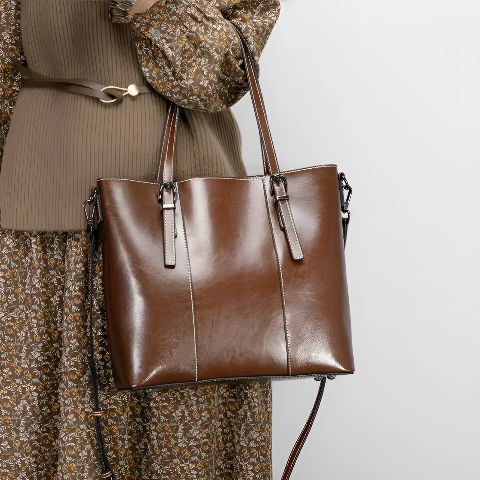 Brown genuine leather retro women's shoulder bag with three straps showing interior organisation compartments