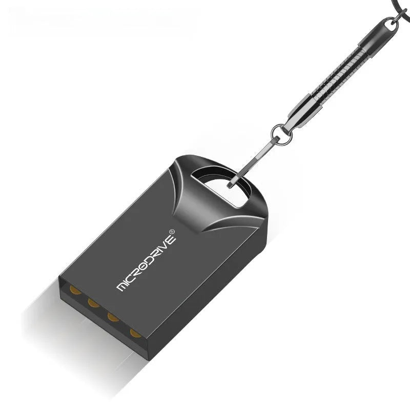 Small black and silver metal USB flash drive showing miniature size