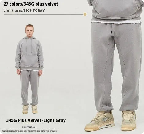 Men's solid colour velvet sweatpants with ankle band detail and mid waist design