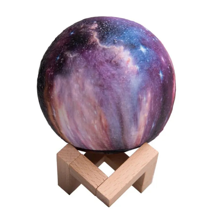 White 3D printed moon-shaped night light on a dark surface, demonstrating its textured surface and soft LED glow.
