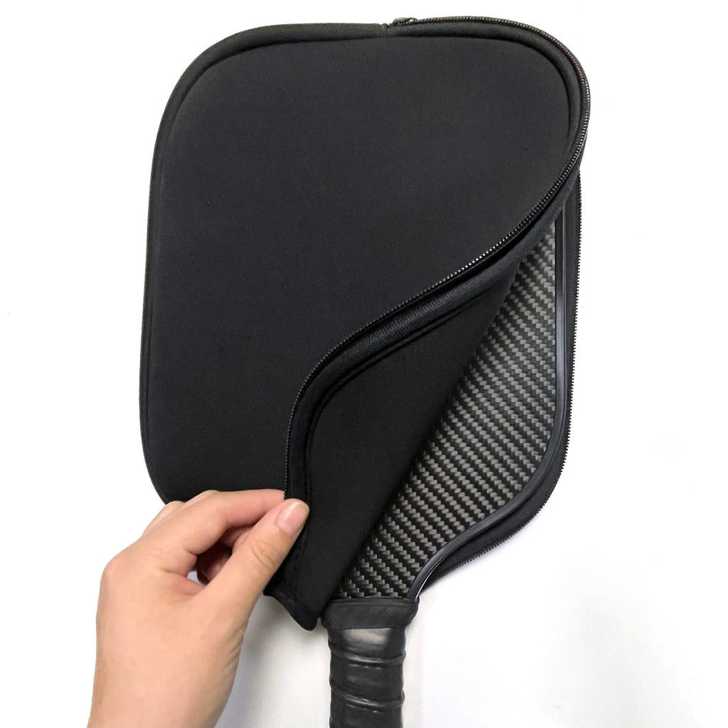 A black neoprene protective sleeve for a table tennis racket blade.