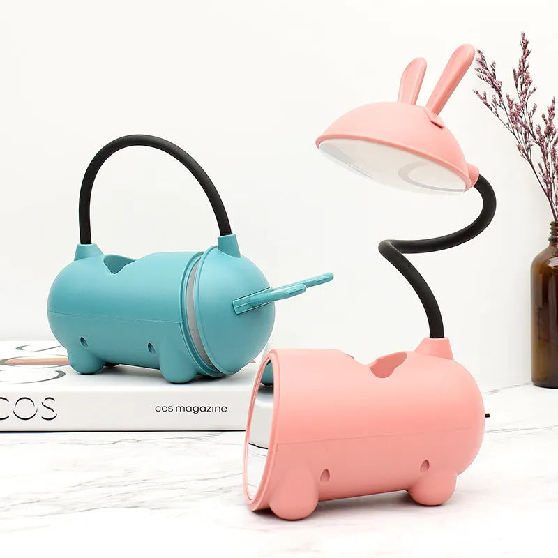 Cartoon USB desk lamp with pen storage container in dark blue colour on desktop