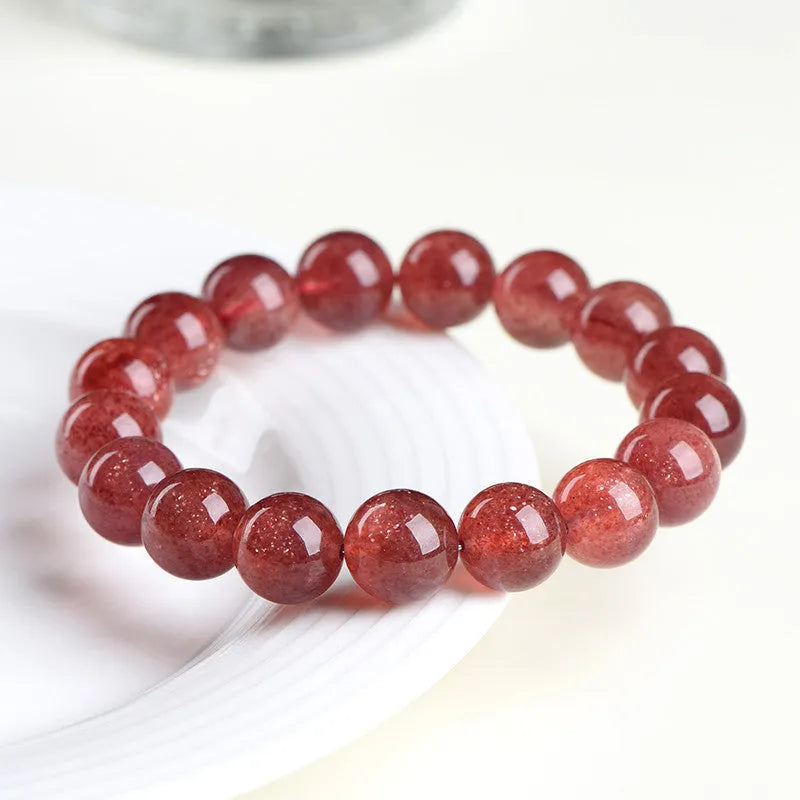 Strawberry quartz crystal bracelet with cherry red starlight colour and geometric beads