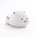 Pink silicone pig-shaped night light with touch control on bedside table