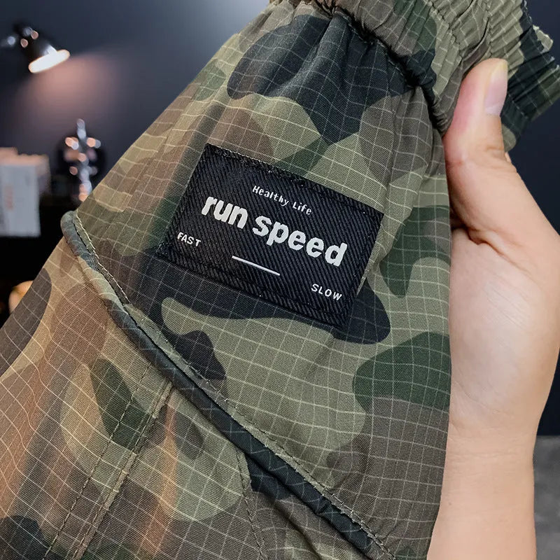 Men's camouflage cargo shorts with quick-dry fabric and loose fit in three colour options