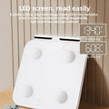 White intelligent body fat scale with eight metal electrodes and a large tempered glass platform.