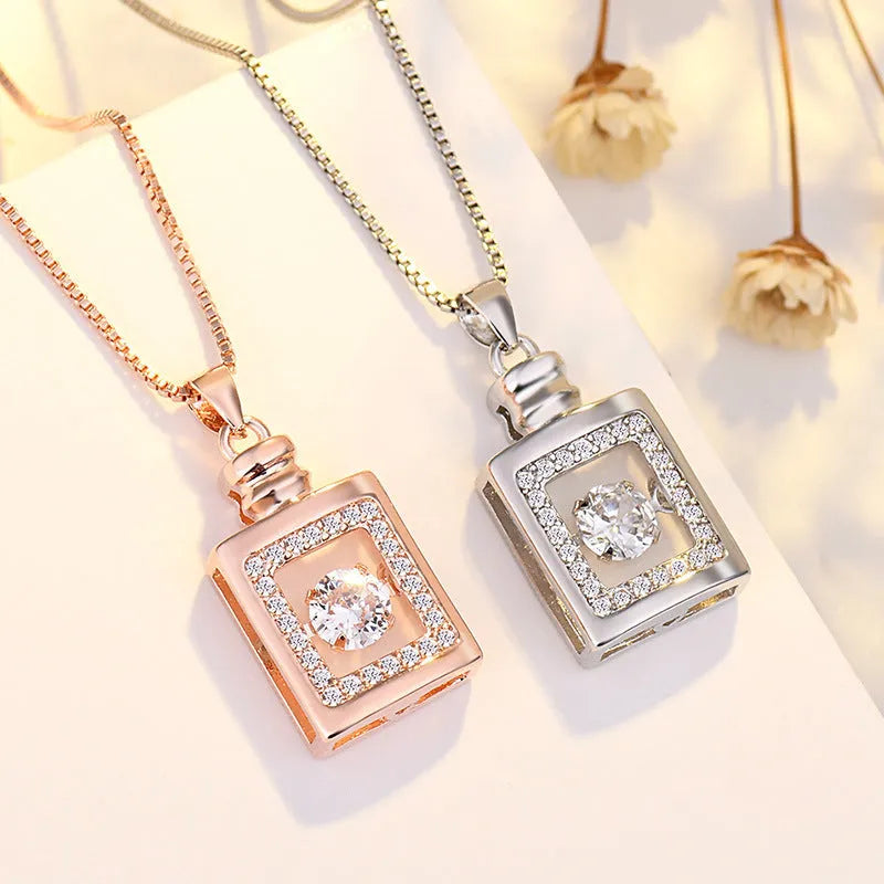 Silver or rose gold plated heart pendant necklace for women with crown and bow detailing on a chain.