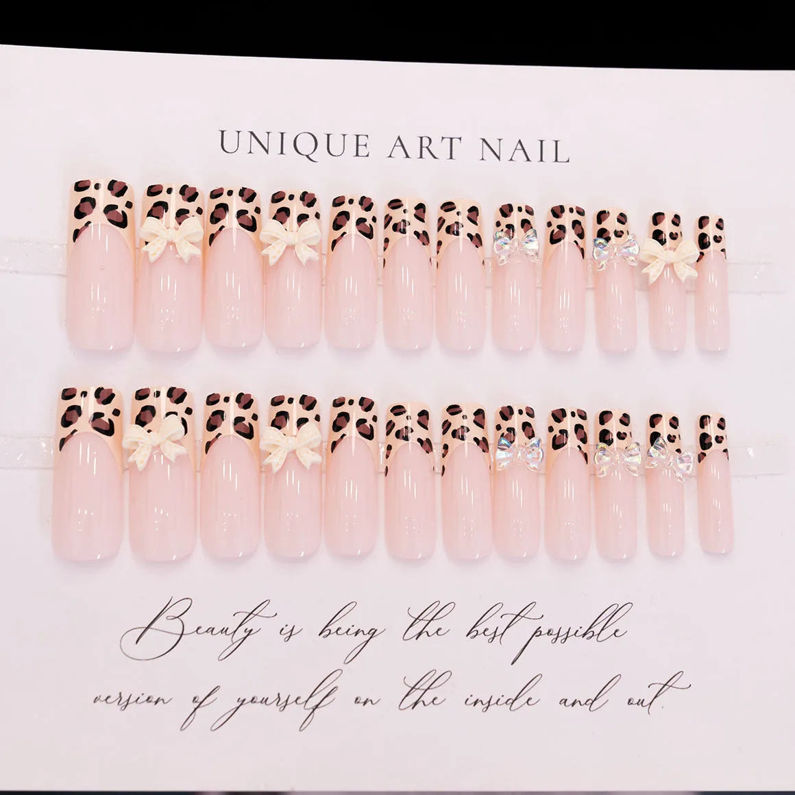 Leopard print butterfly shaped nail art decals on a plastic sheet.