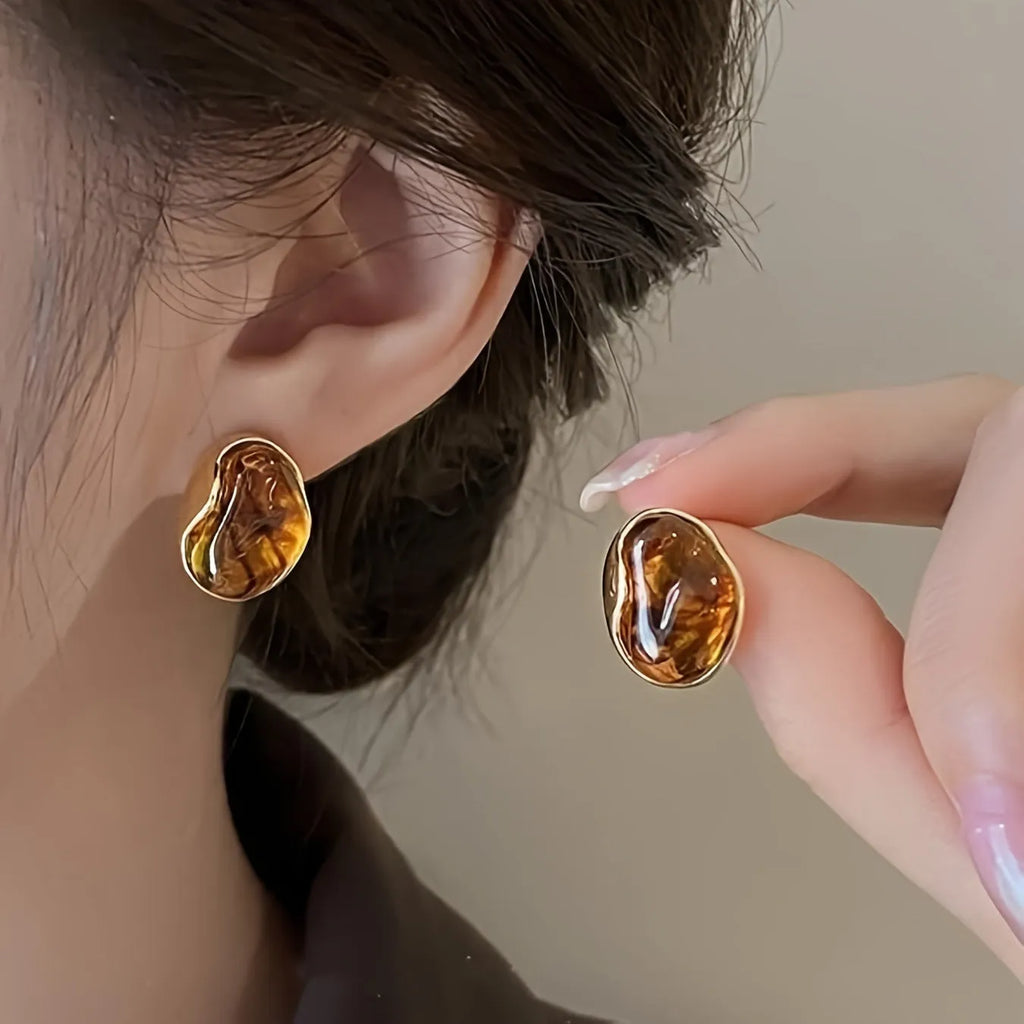 Three pairs of geometric tassel ear rings with electroplated alloy construction in different designs