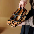 Women's black square toe stiletto ankle-strap shoes with a textured horse hair upper.