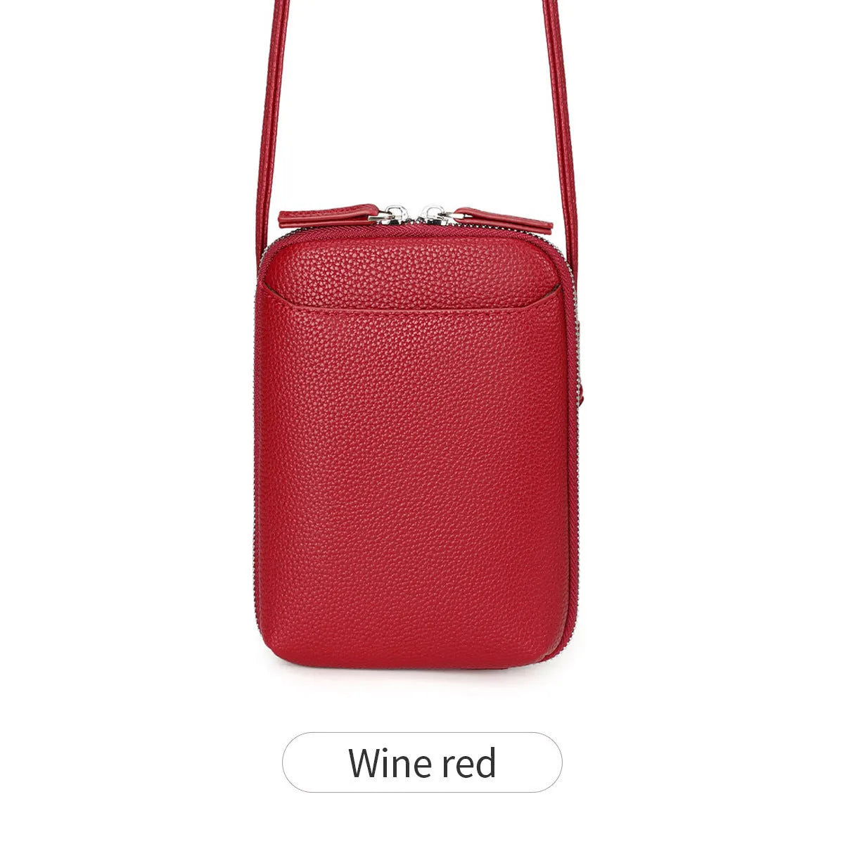 Simple women's vertical crossbody bag in solid colour with stitching details and single strap