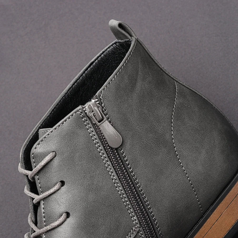 Men's brown plus size Chelsea boot with side zipper, round toe, and low heel.