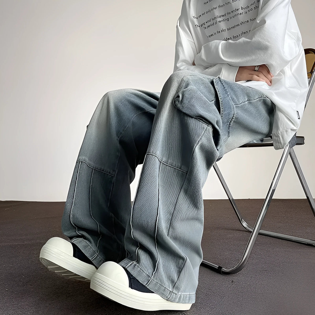 Washed vintage denim men's casual wide-leg pants with drawstring waist and multiple pockets, blue colour, front view