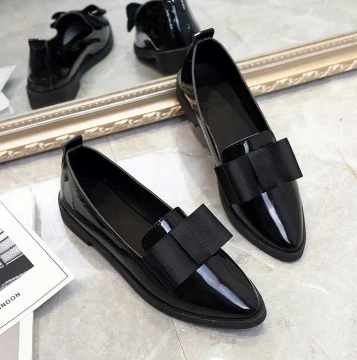 Women's patent leather bowtie flat loafers with pointed toe and low heel in black and claret