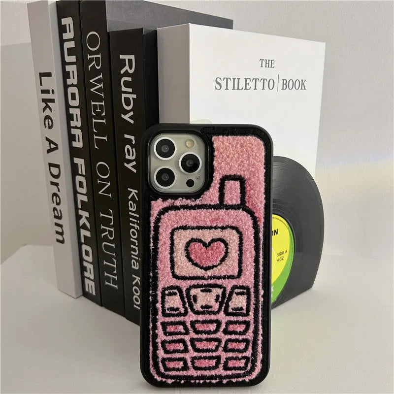 Pink TPU iPhone case with embroidered towel fabric design on back cover