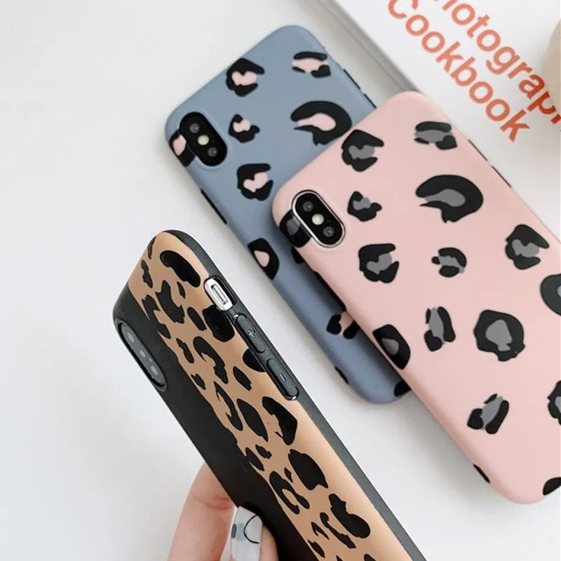 Leopard print pattern hard case for iPhone in black, blue, or pink.