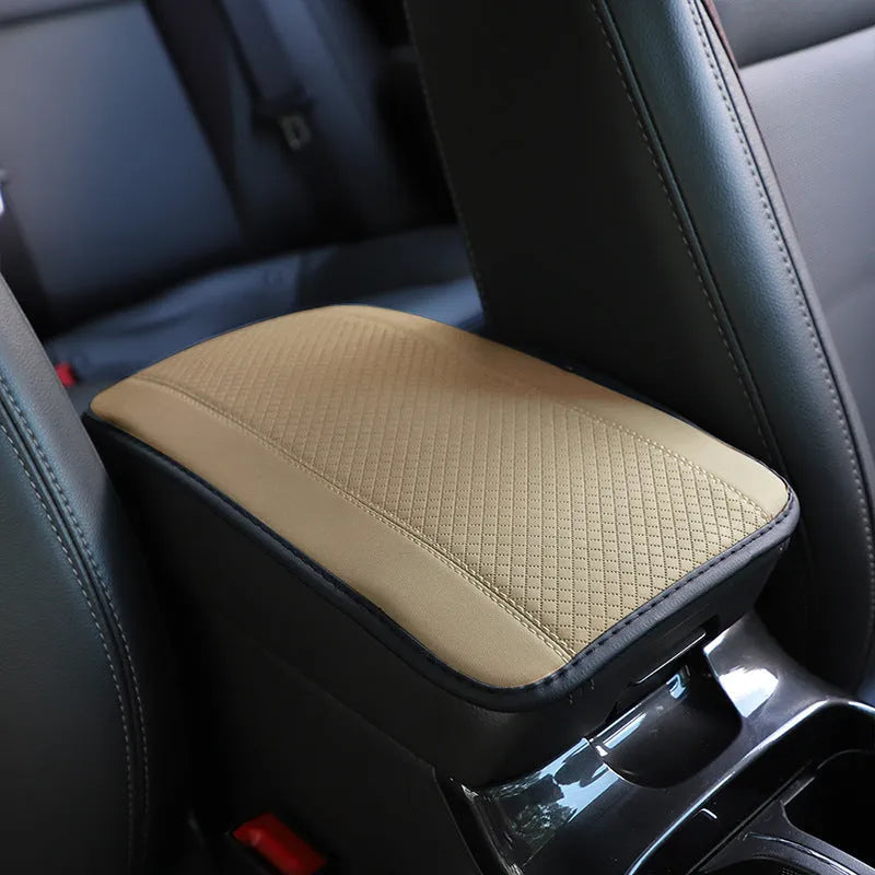Automotive fibre leather embossed armrest box mat measuring 32x19cm in black with red cord detailing