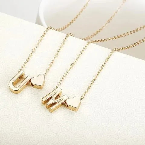 Peach heart shaped letter necklace pendant in gold or silver alloy measuring 20-24mm
