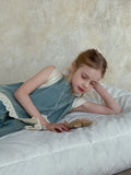 Light blue girls' lace trim denim cropped wide-leg pants and sleeveless vest two-piece set on model