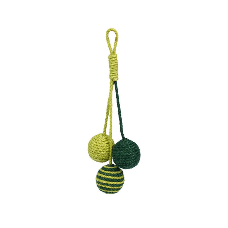Cat toy set with blue and green teaser stick, red and yellow catnip balls, and a tumbling pet on a white background