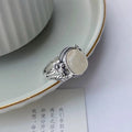Adjustable vintage copper ring with antique finish and imitation white chalcedony colour