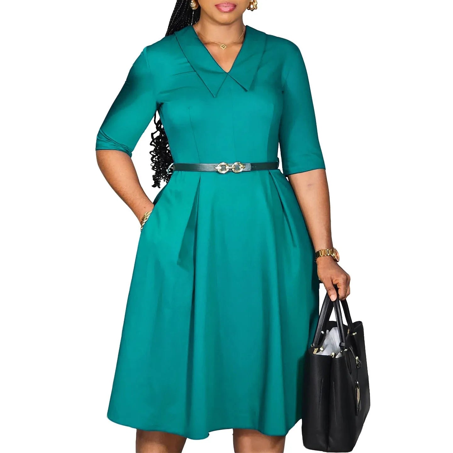 A woman wearing a solid colour African dress with half sleeves and a high waist, featuring a matching belt.